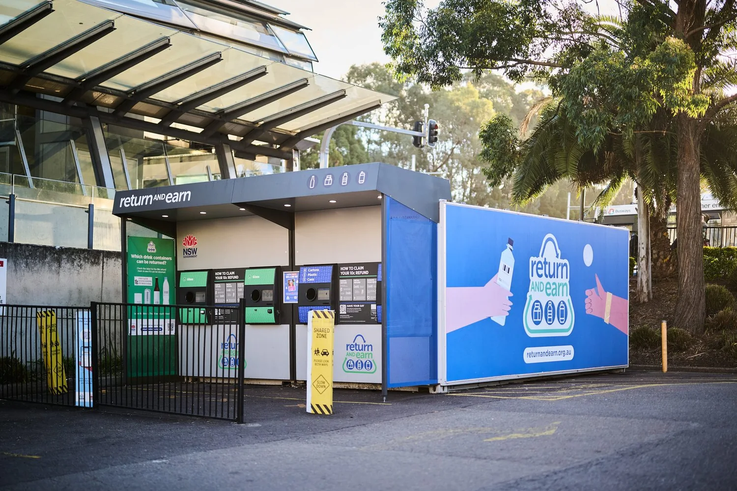 Return and Earn reverse-vending machines installed at an outdoor return point